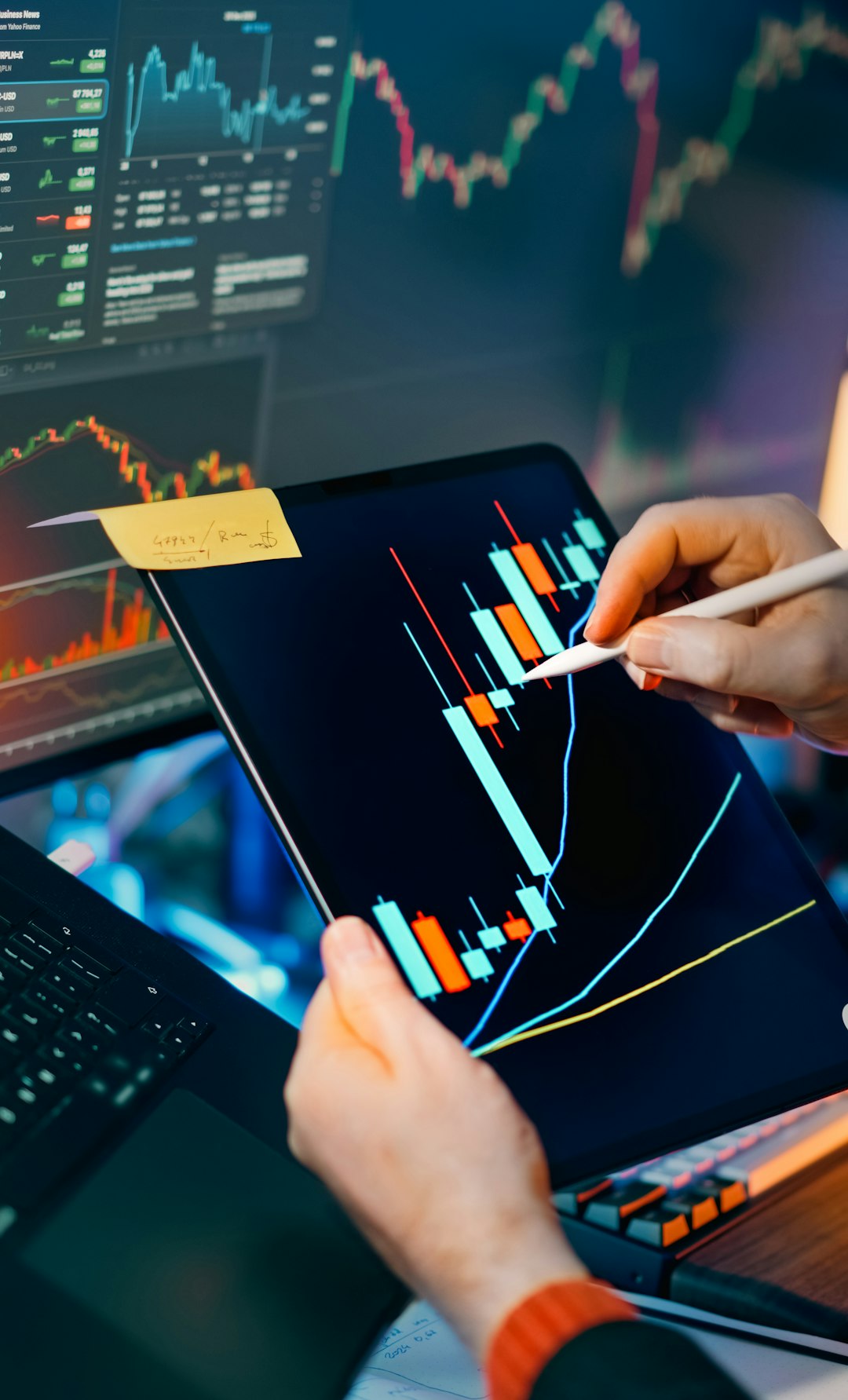 services-01 Stock crypto trading analysis workstation. Closeup hands stylus tablet touchscreen candlestick charts indicators price movement market volatility investing savings portfolio strategy risk management finance technology screens dashboard night lighting focus performance growth profit data economy currency blockchain laptop monitor